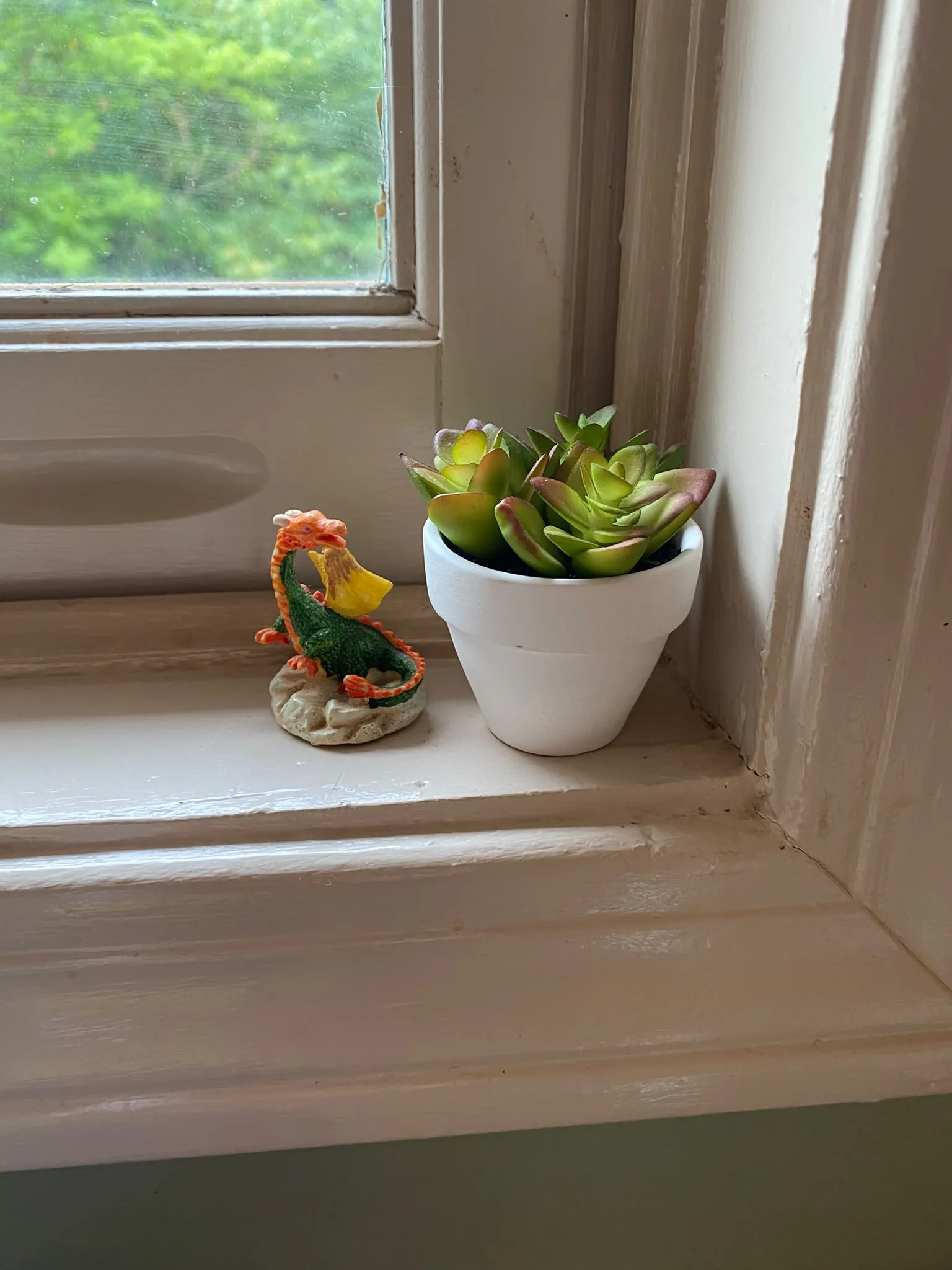small ceramic dragon figurine