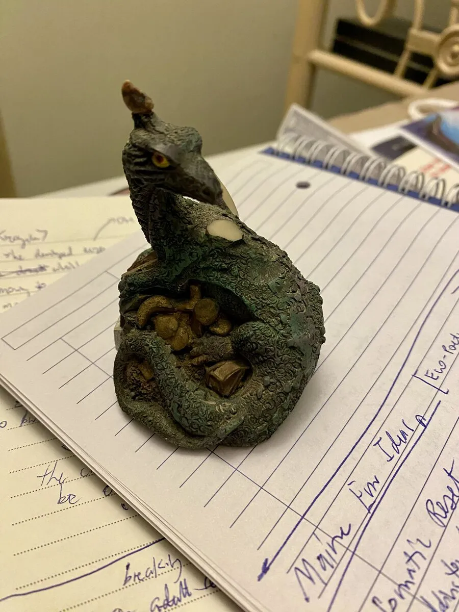 broken dragon figurine with horn